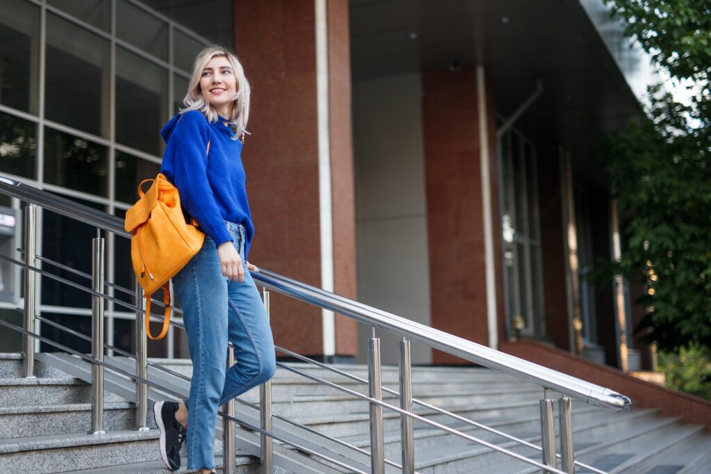 Young female student leaving university